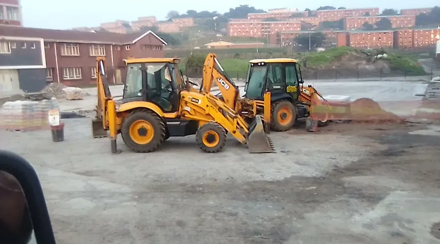 Two of Sherry's JCB TLBs parked together at the end of a shift