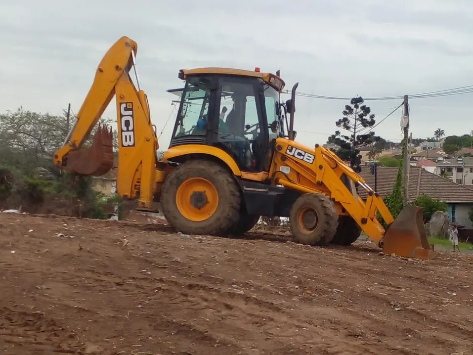 Sherry's JCB TLB levelling a cleared platform above a Durban suburb